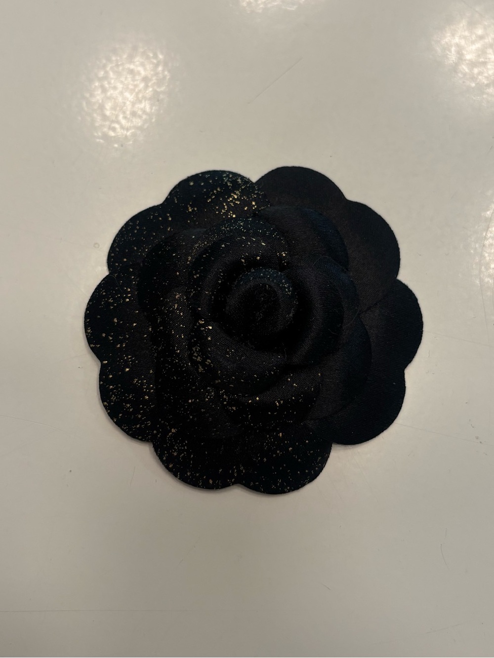 Chanel Camellia flower black and gold accent